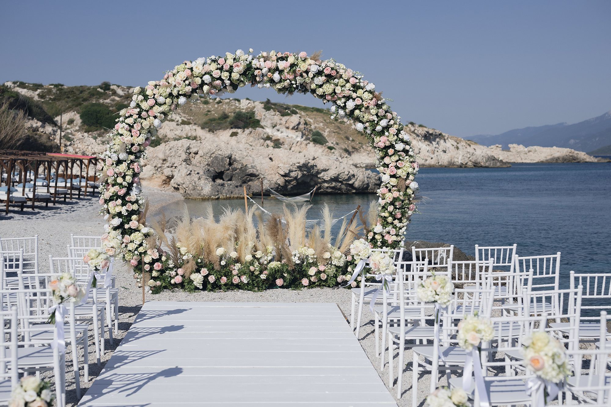 Emotional seaside wedding ceremony of Kosmas and Jacqueline at Proteas Blue Resort, Samos.