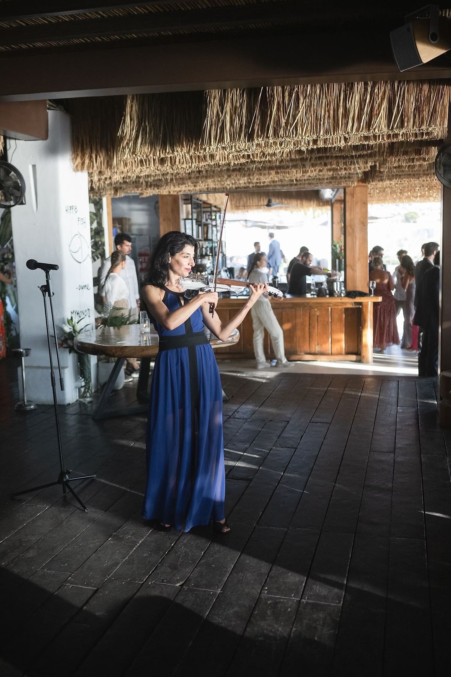 A violinist performing during Martina and Justin’s Mykonos wedding reception
